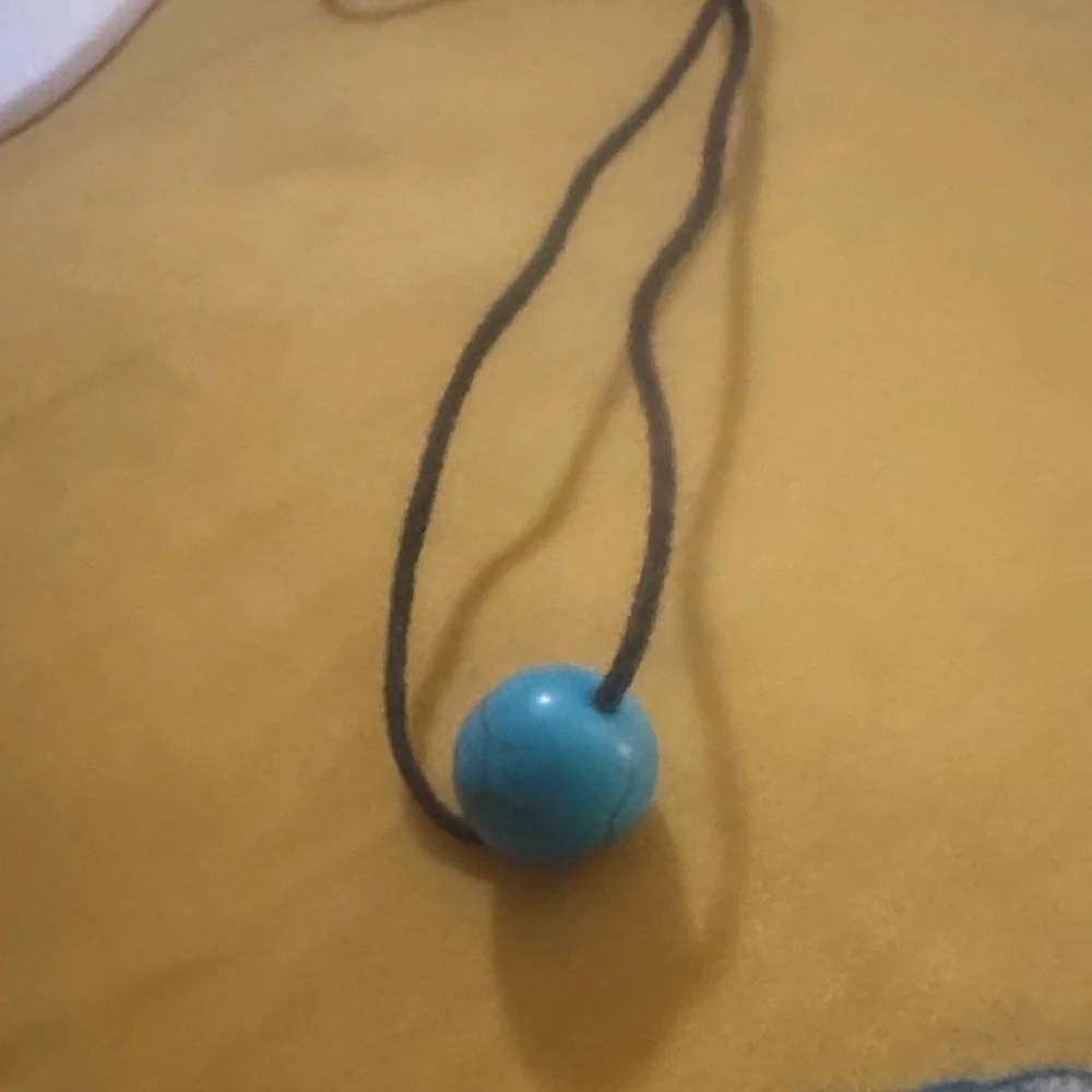 Turquoise Blue Round Bead Pendant on Black String